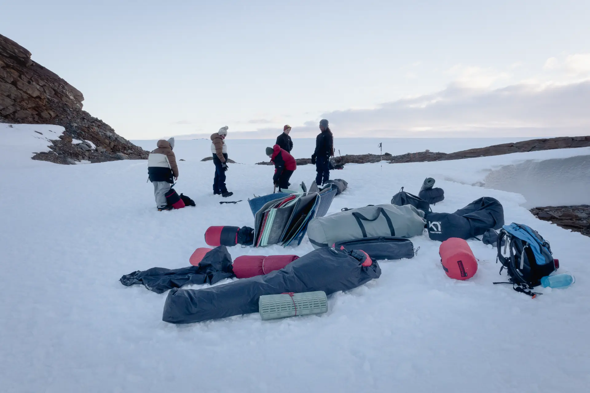 Expedition members setting up camp on the Antarctic ice together