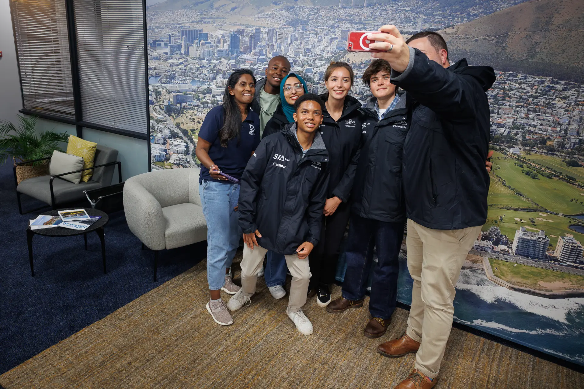 The 2025 expedition winners and team gathered indoors at Antarctica House in Cape Town for final briefings and kit up before the flight south